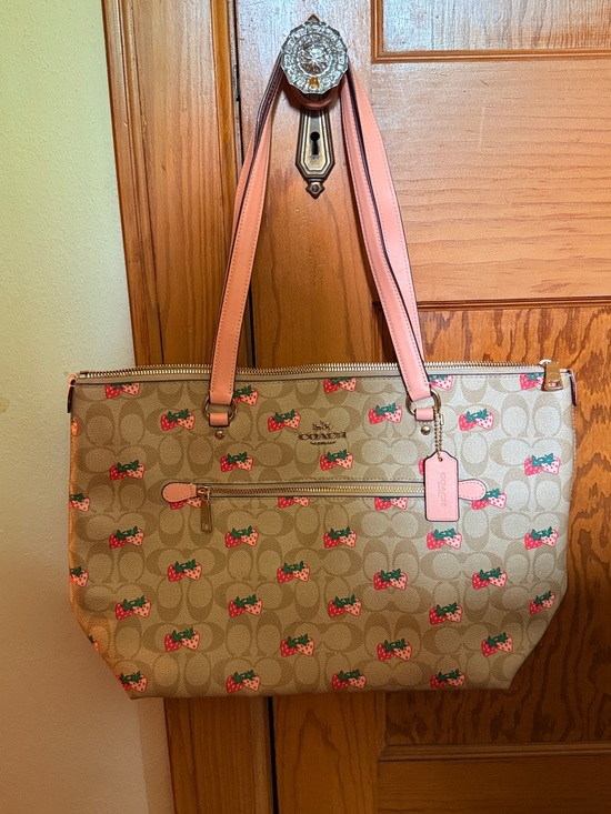 Coach Handbags - Coach Beige Signature Tote with Pink Strawberry Print and Pink Straps
